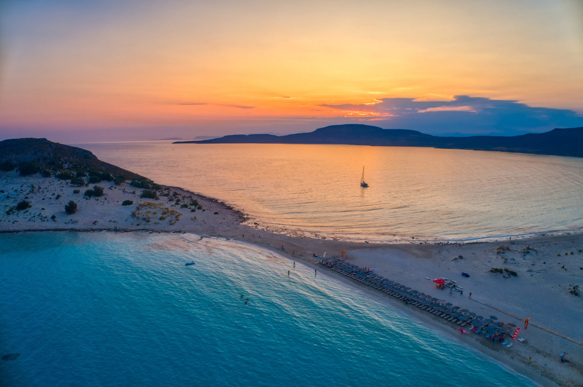 Aerial view of Simos beach at sunset in Elafonisos island in Greece. Elafonisos is a small Greek island the Peloponnese with idyllic exotic beaches and crystal clear waters. Laconia, Greece, Europe